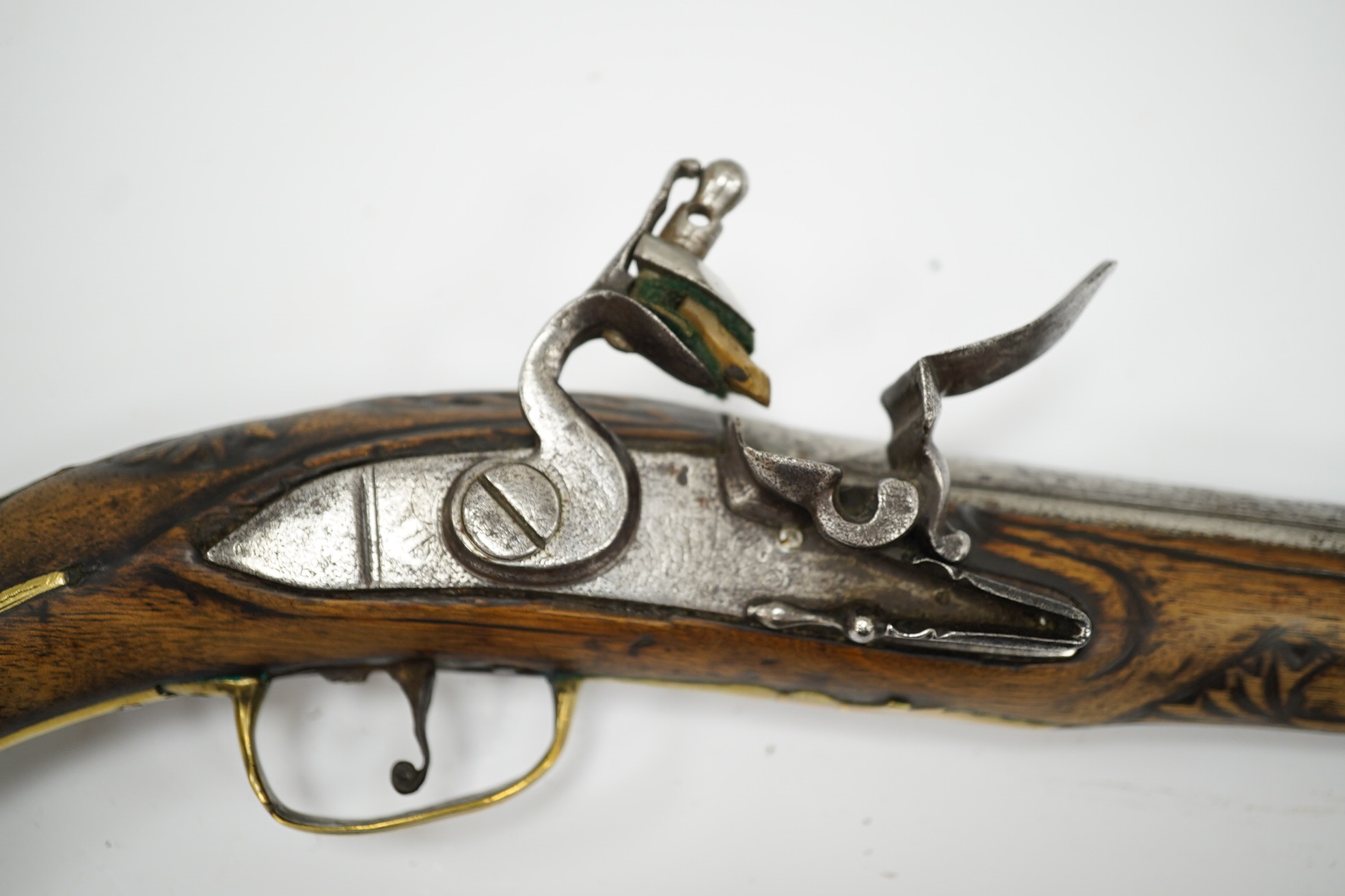 A Turkish flintlock Kubar pistol, with fully stocked brass mounts, polished steel lock and barrel (well worn), barrel 31cm, and a double barrel 12 bore percussion pistol cut down from a sporting gun, barrel 26.5cm, (2).